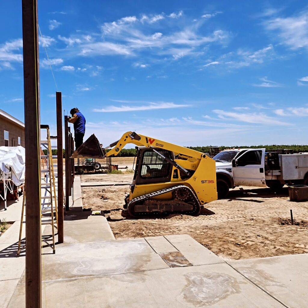 Fence posts being set on a commercial site