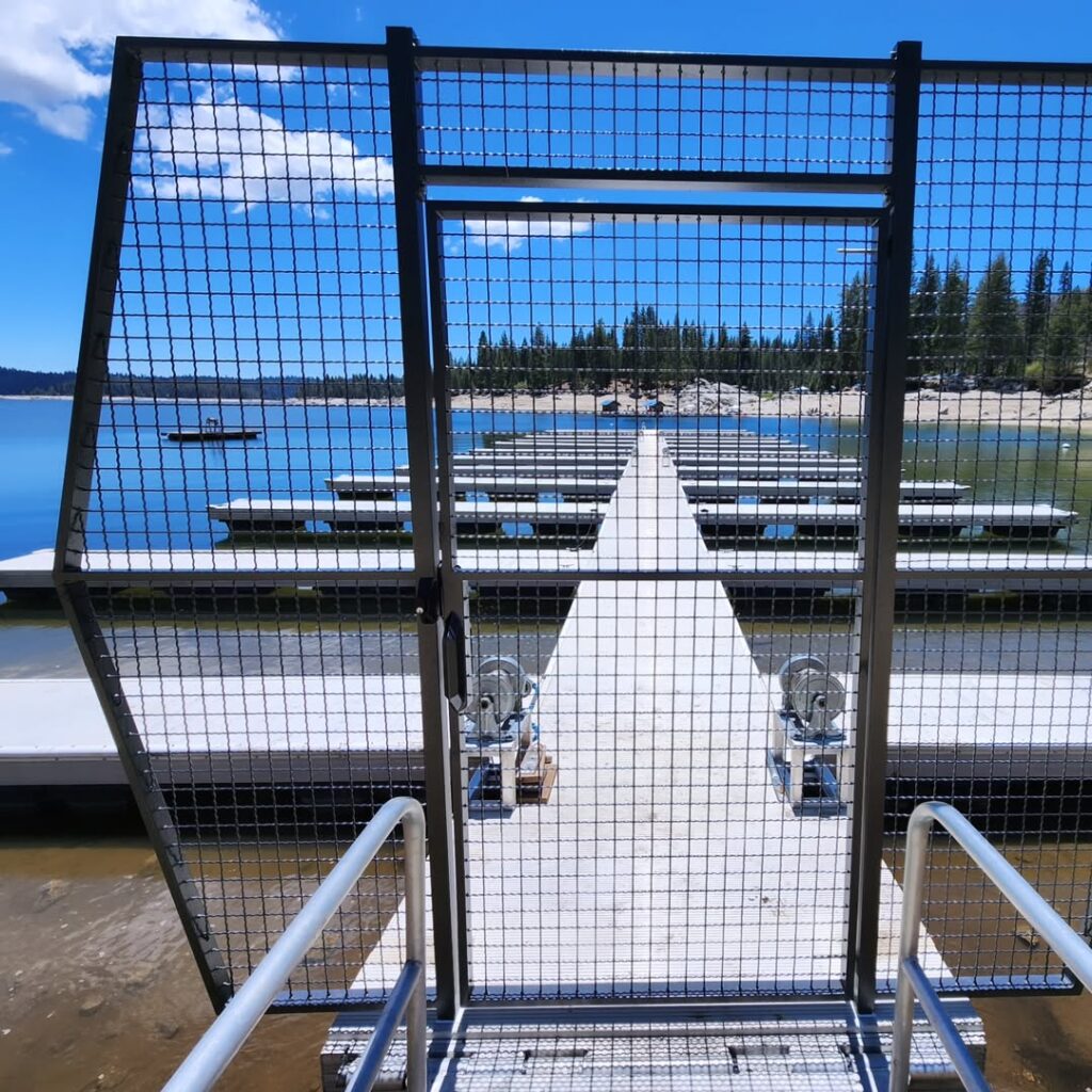 Steel mesh security gate at a lake dock