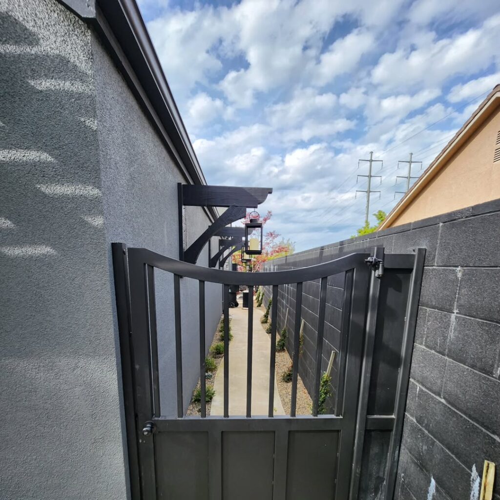 Black steel side yard gate