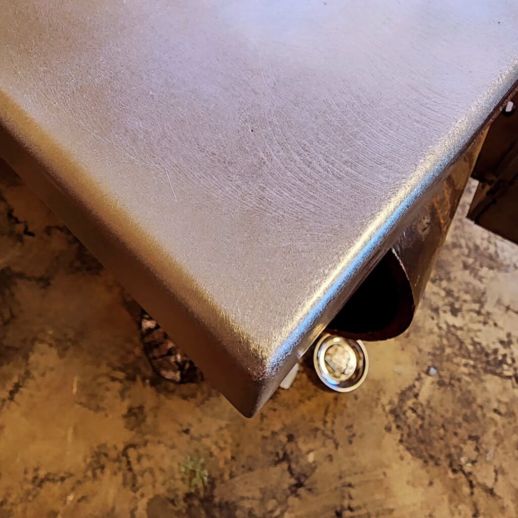 Close up of a finished welded and ground steel edge