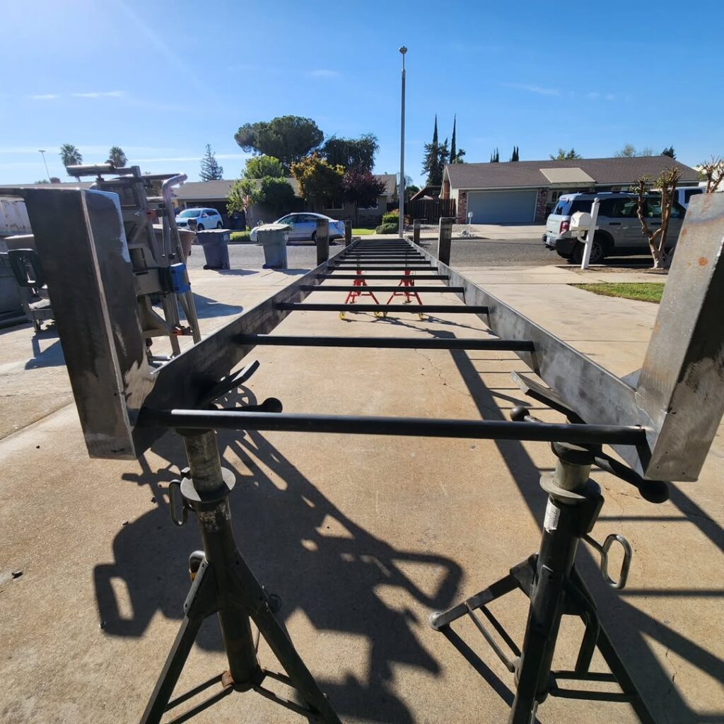 Trailer frames being built in the yard