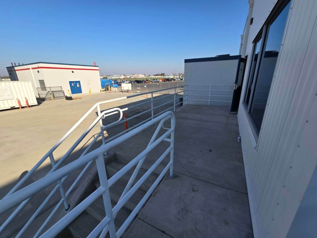 Aluminium ramp and handrail at a building entrance